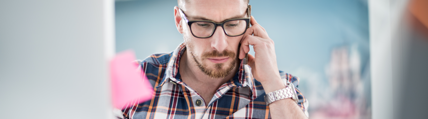 Picture of an employee using interactive voice notification system.