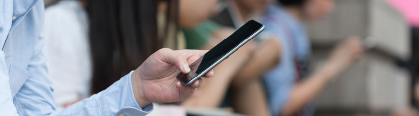 Picture of a person using closed loop mobile payment.